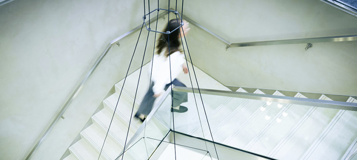 A woman is walking down a staircase in a building.

AI generated content