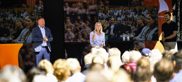 Speakers on stage at an AI event at Arendalsuka 2025, addressing an outdoor audience.